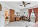 Spacious bedroom with a view of the ensuite and a well-lit vanity, blending comfort with functionality at 23227 Club Villas Dr # 38, Land O Lakes, FL 34639