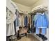 Organized walk-in closet with ample shelving and hanging space, maximizing storage and accessibility at 23227 Club Villas Dr # 38, Land O Lakes, FL 34639