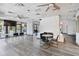 Spacious clubhouse interior featuring fireplace, seating, and ample natural light at 23227 Club Villas Dr # 38, Land O Lakes, FL 34639