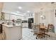 Open-concept kitchen with an eat-in kitchen area and a modern black refrigerator at 23227 Club Villas Dr # 38, Land O Lakes, FL 34639