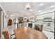 Open kitchen, dining, and living area with natural lighting and tile flooring at 23227 Club Villas Dr # 38, Land O Lakes, FL 34639