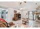 Inviting living room with tile flooring, a stone fireplace, and comfortable seating at 23227 Club Villas Dr # 38, Land O Lakes, FL 34639