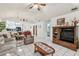 Spacious living room with tile flooring, comfortable seating, and decorative accents throughout at 23227 Club Villas Dr # 38, Land O Lakes, FL 34639