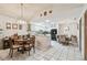 Open-concept with dining, kitchen, and living areas. Prominent tile flooring throughout at 23227 Club Villas Dr # 38, Land O Lakes, FL 34639