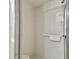 Close-up of a tiled shower stall with safety features, including a grab bar at 23227 Club Villas Dr # 38, Land O Lakes, FL 34639
