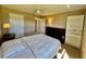 Bedroom with two doors and a large dresser with white bookshelf at 2400 Feather Sound Dr # 1016, Clearwater, FL 33762