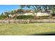 West Feather Sound entrance with mature landscaping and waterway, giving a sense of arrival at 2400 Feather Sound Dr # 1016, Clearwater, FL 33762