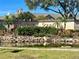 West Feather Sound community entrance with landscaping, sign and waterway, giving a sense of arrival at 2400 Feather Sound Dr # 1016, Clearwater, FL 33762