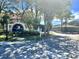 Audubon community entrance with lush landscaping, providing a grand entry to the neighborhood at 2400 Feather Sound Dr # 1016, Clearwater, FL 33762
