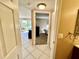 Bright entryway that leads to a bedroom and screened-in porch at 2400 Feather Sound Dr # 1016, Clearwater, FL 33762