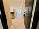 Entry foyer featuring tile flooring and stainless steel kitchen appliances at 2400 Feather Sound Dr # 1016, Clearwater, FL 33762
