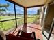 Screened in porch with red tiling and a beautiful view at 2400 Feather Sound Dr # 1016, Clearwater, FL 33762