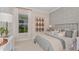 Inviting bedroom with stylish decor, a comfortable bed, and ample natural light, creating a cozy retreat at 26842 Dove Dr, Punta Gorda, FL 33955