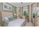 Serene bedroom with a bay window, stylish decor, and plenty of natural light, creating a tranquil retreat at 26842 Dove Dr, Punta Gorda, FL 33955