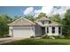 Charming single-story home with a two-car garage, well-maintained landscaping, and neutral color palette at 26842 Dove Dr, Punta Gorda, FL 33955