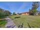 Beautiful backyard with a lush green lawn, mature trees, and a tranquil atmosphere at 320 Seneca Falls Dr, Apollo Beach, FL 33572