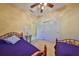 Bedroom with twin beds, ceiling fan, and closet; ideal for sharing or a growing Gathering at 320 Seneca Falls Dr, Apollo Beach, FL 33572