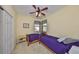 Bedroom with two twin beds, ceiling fan, and closet; perfect for children or guests at 320 Seneca Falls Dr, Apollo Beach, FL 33572