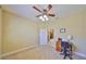 Bedroom with a ceiling fan and an ensuite workspace, perfect for study or creative projects at 320 Seneca Falls Dr, Apollo Beach, FL 33572