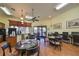 Bright community room with tables, chairs, computers, and coffee bar for residents to enjoy at 320 Seneca Falls Dr, Apollo Beach, FL 33572