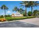 Del Webb Southshore Falls community entrance sign surrounded by well-maintained landscaping and palm trees at 320 Seneca Falls Dr, Apollo Beach, FL 33572