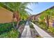 Inviting walkway leads to this charming single-story home with beautiful landscaping at 320 Seneca Falls Dr, Apollo Beach, FL 33572