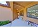 Inviting front porch with seating area and natural light at 320 Seneca Falls Dr, Apollo Beach, FL 33572