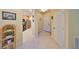 Hallway view of home featuring tile flooring and multiple rooms at 320 Seneca Falls Dr, Apollo Beach, FL 33572