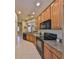 Kitchen features stainless steel appliances, tile floors, and granite countertops at 320 Seneca Falls Dr, Apollo Beach, FL 33572