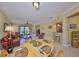 Open floor plan of living room and kitchen/dining area with tile flooring and natural light at 320 Seneca Falls Dr, Apollo Beach, FL 33572