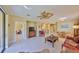 Open-concept living area with tile flooring and access to kitchen and dining at 320 Seneca Falls Dr, Apollo Beach, FL 33572