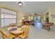 Open concept living room and dining room with tile floors and lots of natural light at 320 Seneca Falls Dr, Apollo Beach, FL 33572