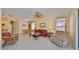 Bright living room with tile floors and ceiling fan at 320 Seneca Falls Dr, Apollo Beach, FL 33572