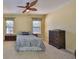 Well-lit main bedroom featuring neutral carpet and a ceiling fan at 320 Seneca Falls Dr, Apollo Beach, FL 33572