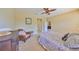 Bright bedroom with neutral carpet, a ceiling fan, and closet access at 320 Seneca Falls Dr, Apollo Beach, FL 33572