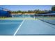 Well-maintained tennis courts surrounded by fencing, offering a recreational amenity for residents at 320 Seneca Falls Dr, Apollo Beach, FL 33572