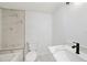 Modern bathroom showcasing new fixtures, a bathtub and shower combo, and an updated sink and vanity at 407 Cranberry Ln, Brandon, FL 33510