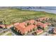 Waterfront community aerial view showcasing multiple buildings, parking, and surrounding greenery at 4323 Bayside Village Dr # 314, Tampa, FL 33615