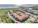 Aerial view of waterfront community featuring multiple buildings, parking, and lush surroundings at 4323 Bayside Village Dr # 314, Tampa, FL 33615
