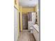 Bright bathroom featuring a tiled walk-in shower, white vanity and linen closet at 4323 Bayside Village Dr # 314, Tampa, FL 33615