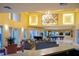 Spacious clubhouse featuring a seating area with sofas, piano, and billiard tables at 4323 Bayside Village Dr # 314, Tampa, FL 33615