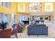 The clubhouse with comfortable seating, a piano, and billiard tables under a decorative chandelier at 4323 Bayside Village Dr # 314, Tampa, FL 33615