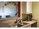 Cozy kitchen with stainless steel sink, laminate counters and view to the dining area at 4323 Bayside Village Dr # 314, Tampa, FL 33615