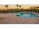 Relaxing community pool with ample lounge chairs and covered seating areas amidst lush landscaping at 4323 Bayside Village Dr # 314, Tampa, FL 33615