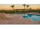 Inviting community pool featuring a brick pool deck, palm trees and plenty of lounging areas at 4323 Bayside Village Dr # 314, Tampa, FL 33615