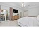 Stylish main bedroom features sliding glass doors to the patio and an entertainment console at 5035 Pinelake Rd, Wesley Chapel, FL 33543