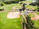 Aerial shot showcasing multiple baseball fields and surrounding green spaces at 6125 Gannetwood Pl, Lithia, FL 33547