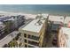 Aerial view of the condo building and the beach at 74 Gulf Blvd # 1B, Indian Rocks Beach, FL 33785