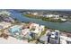 Aerial view showing condo buildings close to the beach and waterway at 74 Gulf Blvd # 1B, Indian Rocks Beach, FL 33785