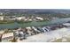 Aerial view features beachfront houses, scenic waterfront, and peaceful community at 74 Gulf Blvd # 1B, Indian Rocks Beach, FL 33785